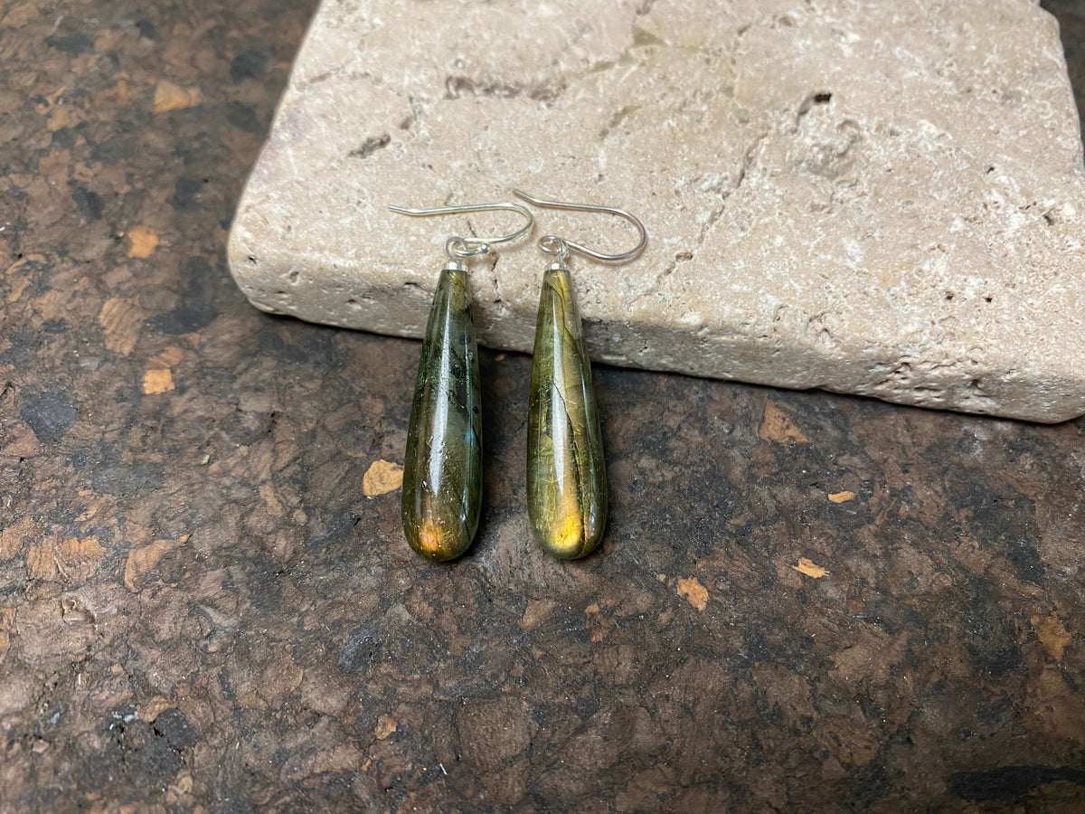 Simply elegant labradorite earrings, crafted from natural labradorite stones to show off their stunning lustre and fire. Sterling silver hoops complete the look. Length 4.6 cm