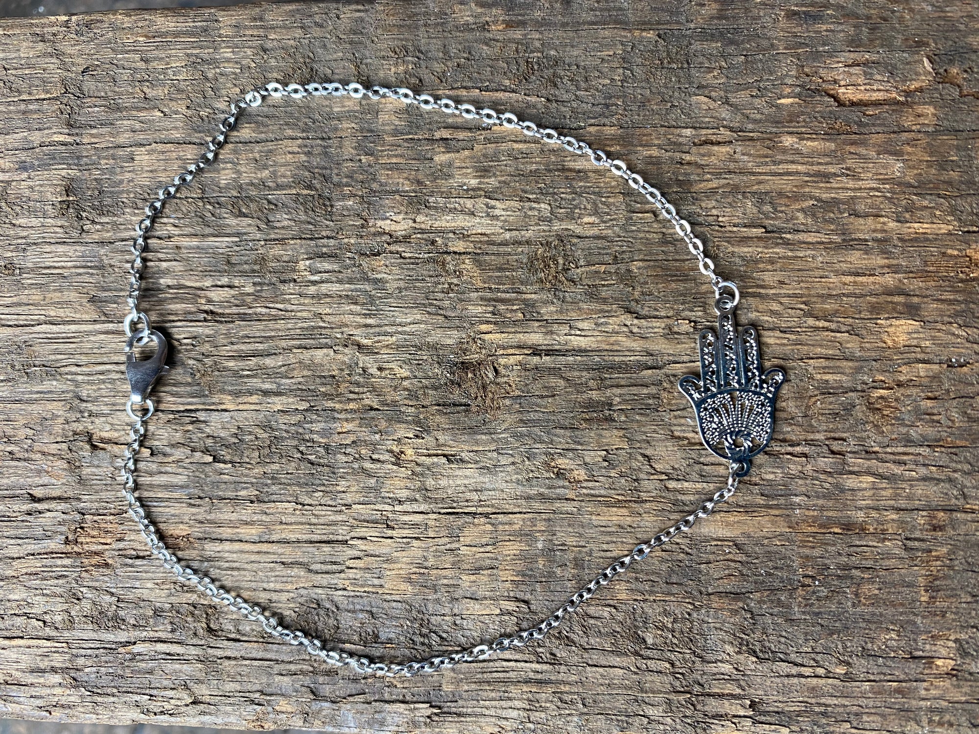 Hamsa anklet features a hamsa pendant on a fine chain and is made from a non-allergenic white metal that looks exactly like silver and will not ever tarnish, rust or wear