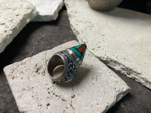 A heavy and substantial vintage ring from Turkmenistan. Sterling silver, turquoise and coral inlay, mid 20th century, size 9.25