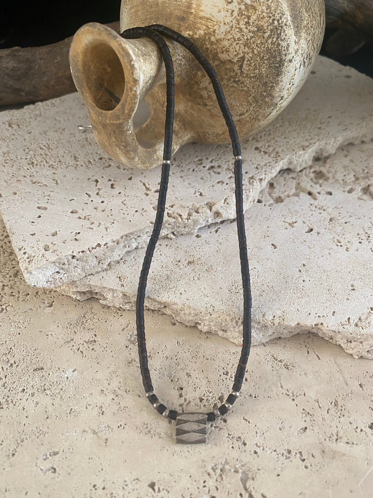 One of our signature coconut silver necklaces, crafted from polished enriched coconut wood, Karen hill tribe 95% silver beads, and a sterling silver clasp. A women's necklace or a men's necklace, it has a casual Boho vibe. Different lengths available