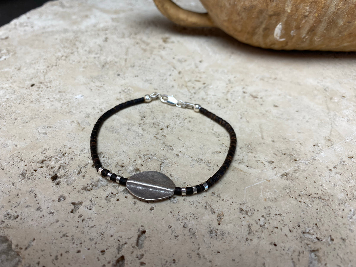 One of our signature coconut silver bracelets, crafted from polished coconut wood and hill tribe 95% silver., with sterling silver lobster clasp. A women's bracelet or a men's bracelet, it has a casual Boho vibe, and is made for that stacked bracelet look. Different sizes available