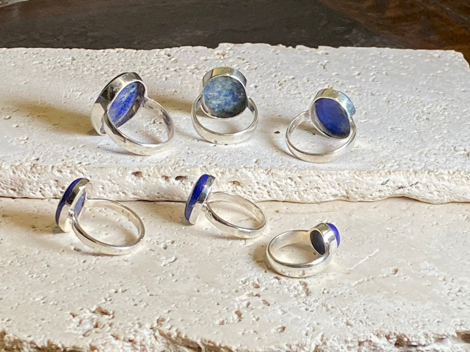 Lapis lazuli stone rings set in sterling silver. Each ring is unique, cut and mounted to showcase the beauty of the individual stones. The lapis is from Afghanistan, completely natural.