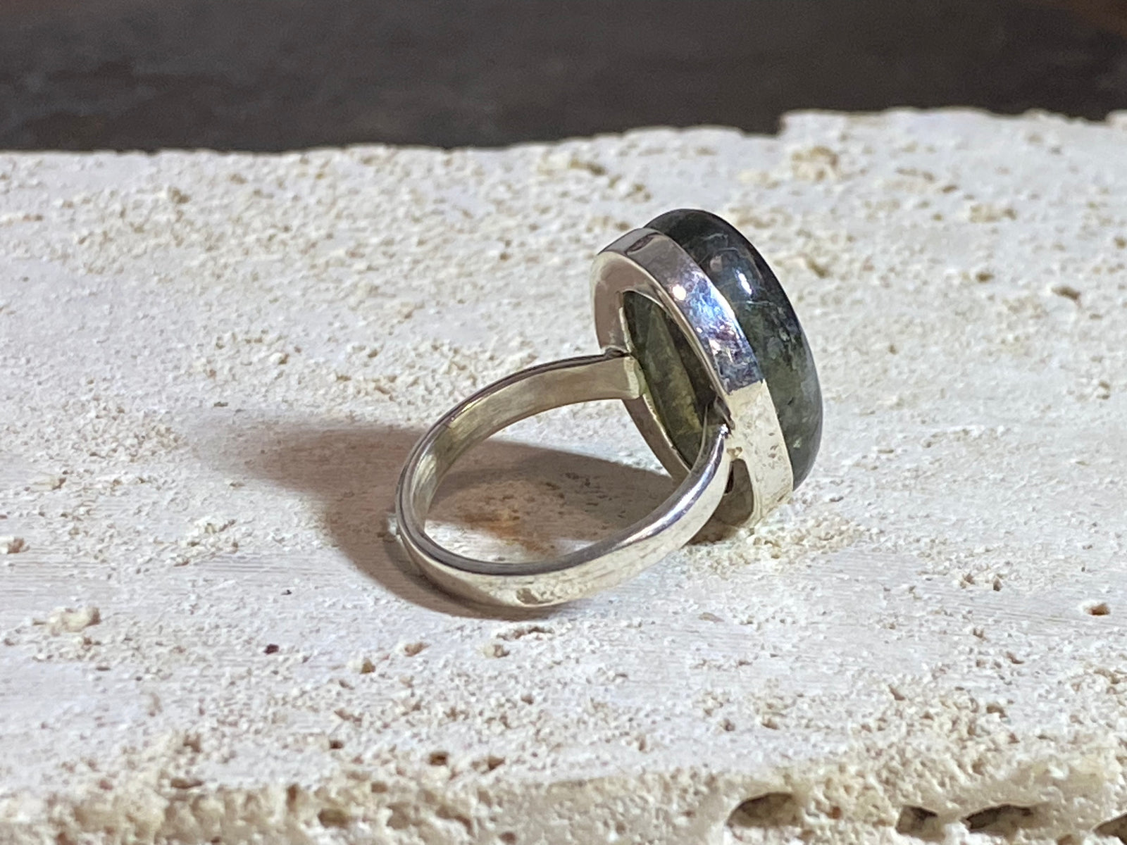 Oval labradorite ring set in heavy sterling silver. A high quality stone with excellent dark blue luminosity and fire.  Size 7.75