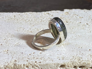 Oval labradorite ring set in heavy sterling silver. A high quality stone with excellent dark blue luminosity and fire.  Size 7.75