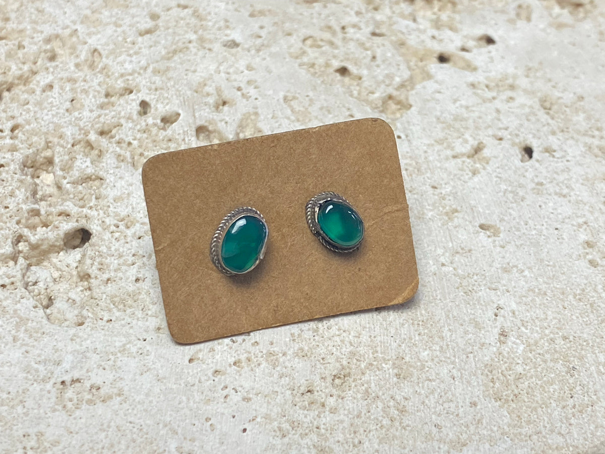 Small chrysoprase earring studs are hand made from sterling silver and set with clear green chrysoprase cabochons. A unisex earring