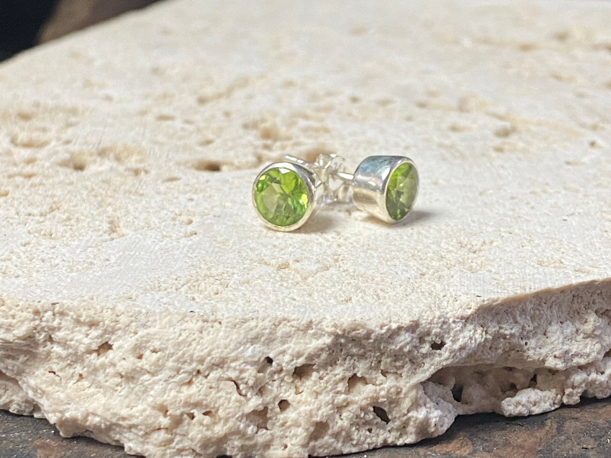 Elegant facet cut peridot and sterling silver earring studs, diameter 7 mm height 5 mm