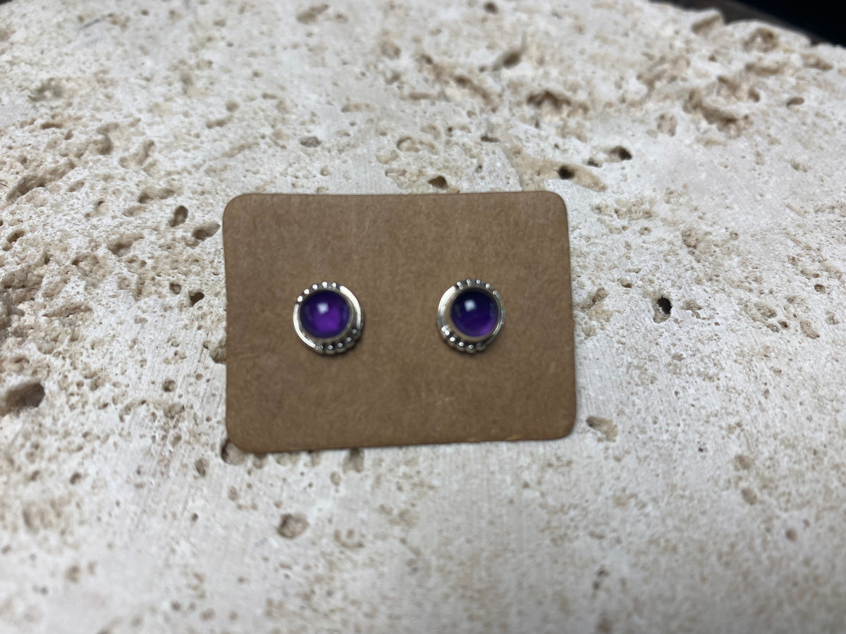 small amethyst earring studs are hand made from sterling silver