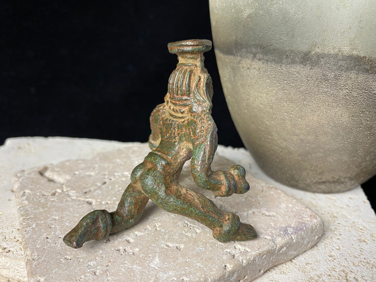 Bal Gopal Krishna. This antique devotional baby Krishna statue is cast from solid bronze, in a crawling posture carrying butter in his hand, 19th century, Orissa Provence, India. This statue has a darkened patina commensurate with its age. Measurements: height 6 cm (2.5"), length 6 cm (2.5")