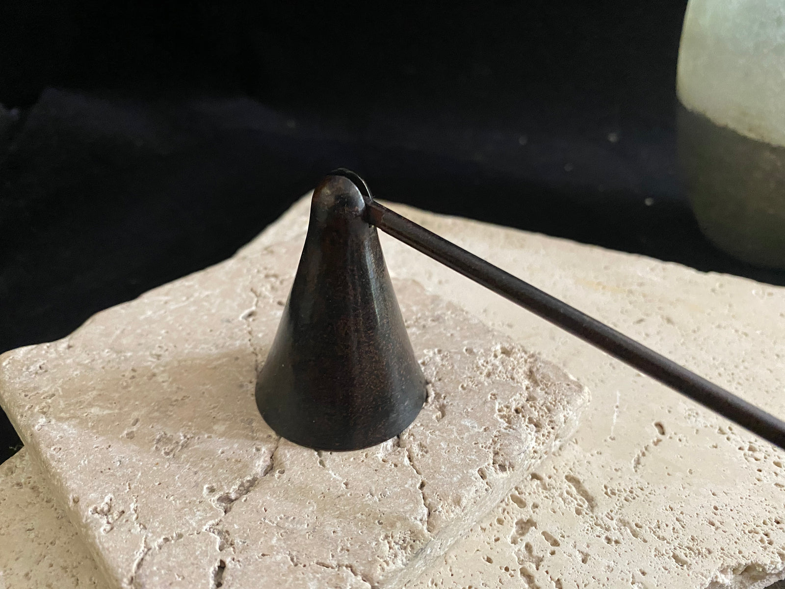 Metal candlesnuffer in bronze finish with a swivel head. Practical and stylish with a comfortable grip and swivel head to allow a candle to be snuffed from all angles. Measurements: 35 cm (13.77") length, stick length 31 cm (12.2)