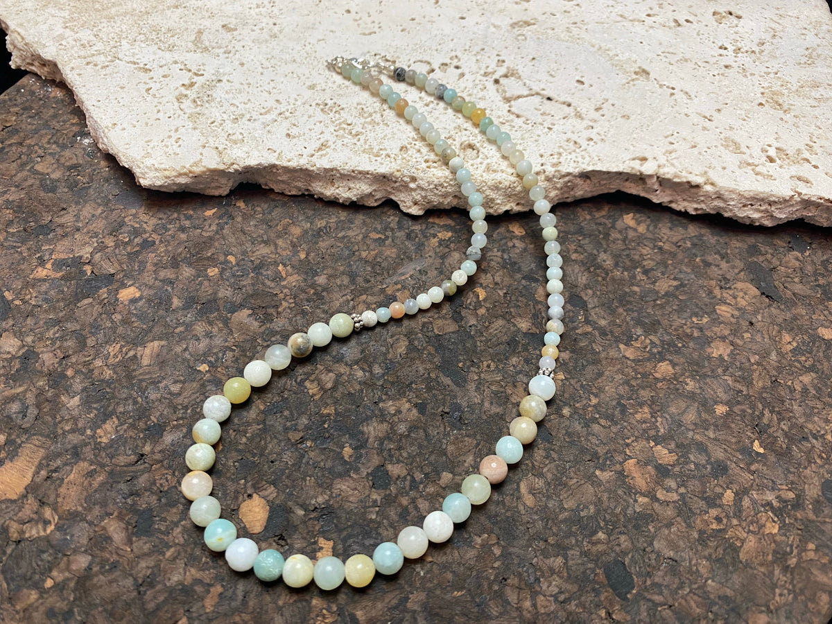 Glowing natural pastel hued graduated quartz beads teamed with sterling silver feature beads and findings