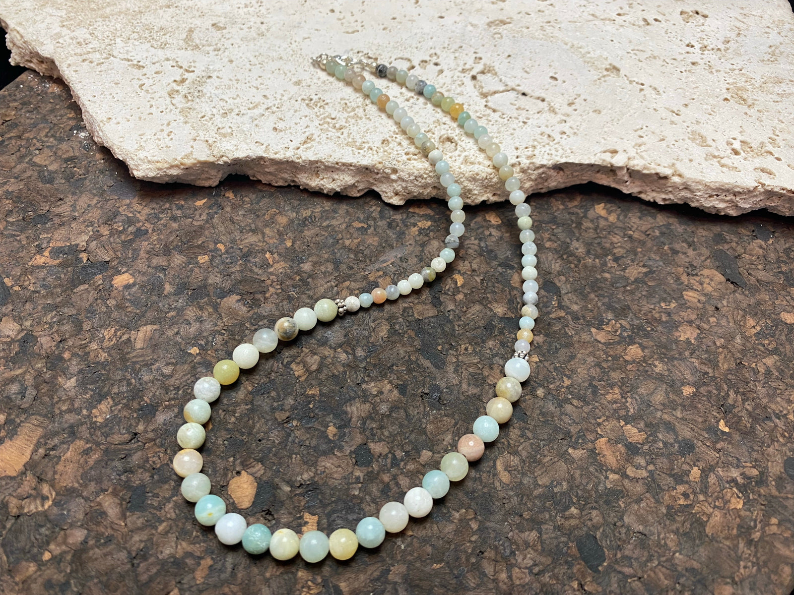 Glowing natural pastel hued graduated quartz beads teamed with sterling silver feature beads and findings