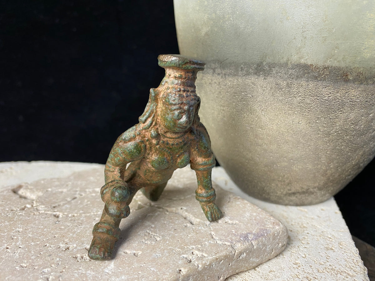 Bal Gopal Krishna. This antique devotional baby Krishna statue is cast from solid bronze, in a crawling posture carrying butter in his hand, 19th century, Orissa Provence, India. This statue has a darkened patina commensurate with its age. Measurements: height 6 cm (2.5"), length 6 cm (2.5")