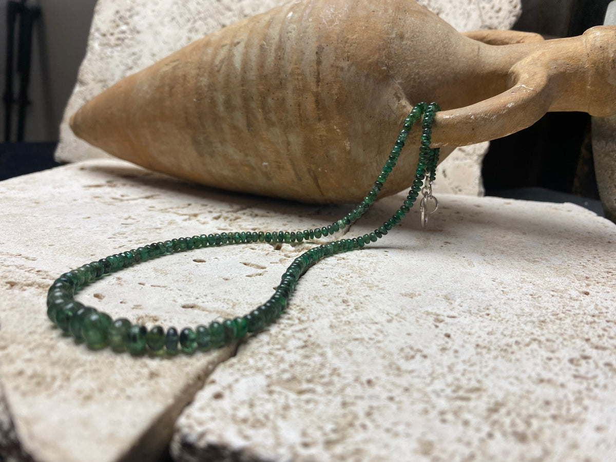 Stunning natural emerald necklace of perfectly drilled and graduated cabochon cut African emeralds finished with a sterling silver hook clasp. Not dyed or heat treated. Premium stringing on jeweller's monofilament. Length 44 cm, 52.6 Ct.