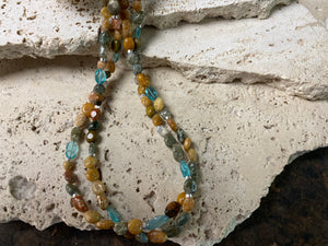 A casual beach vibe necklace made from two strands of polished pebble ocean jasper, highlighted with clear blue apatite and sterling silver. Our necklace is finished with a sterling silver hook clasp and findings and is 49 cm in length