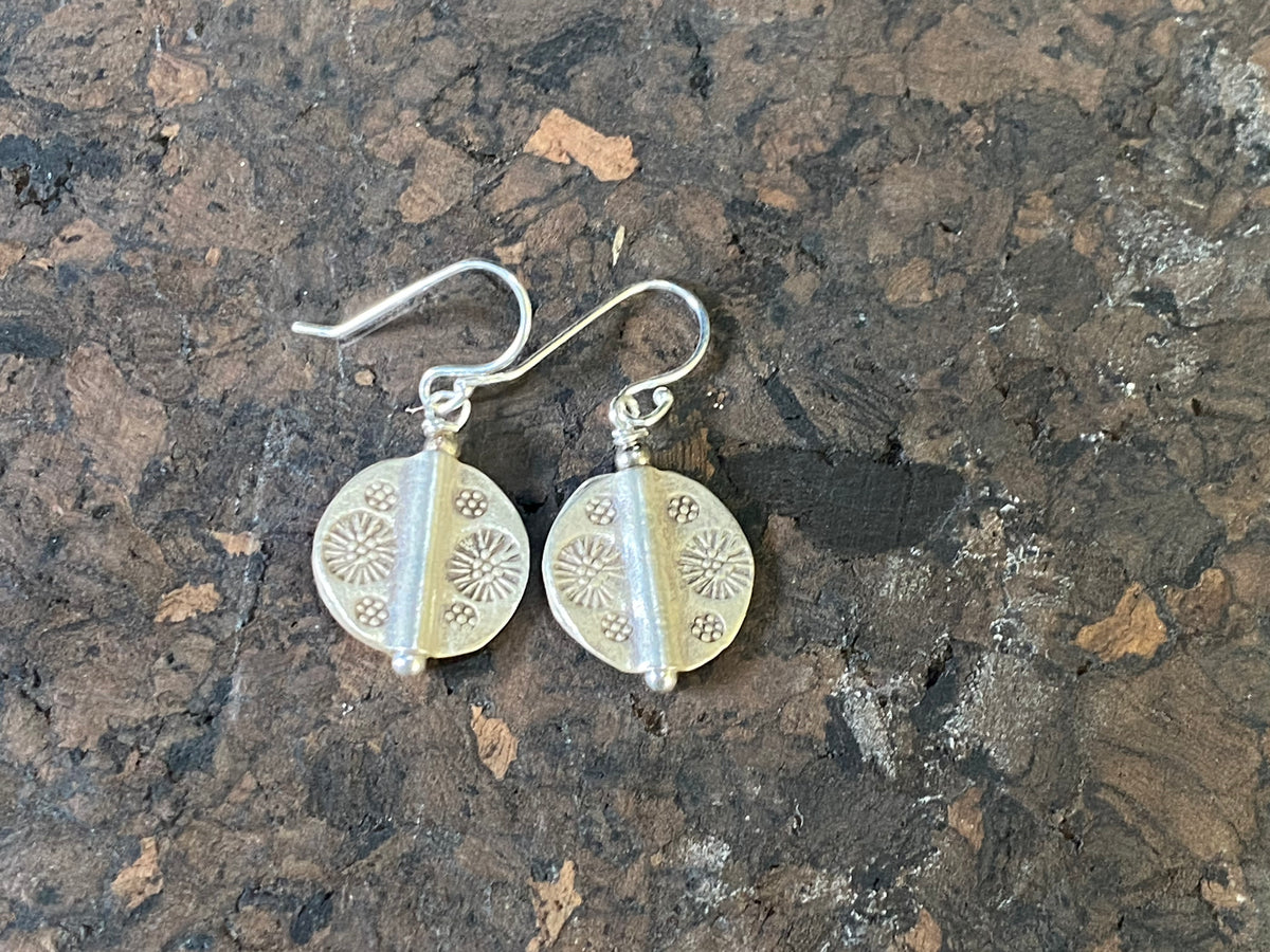 Our most popular earring. Karen hill tribe charms of high grade silver finished with sterling silver hooks.  Charm 1.5 cm diameter, earring length 2.8 cm including hook 