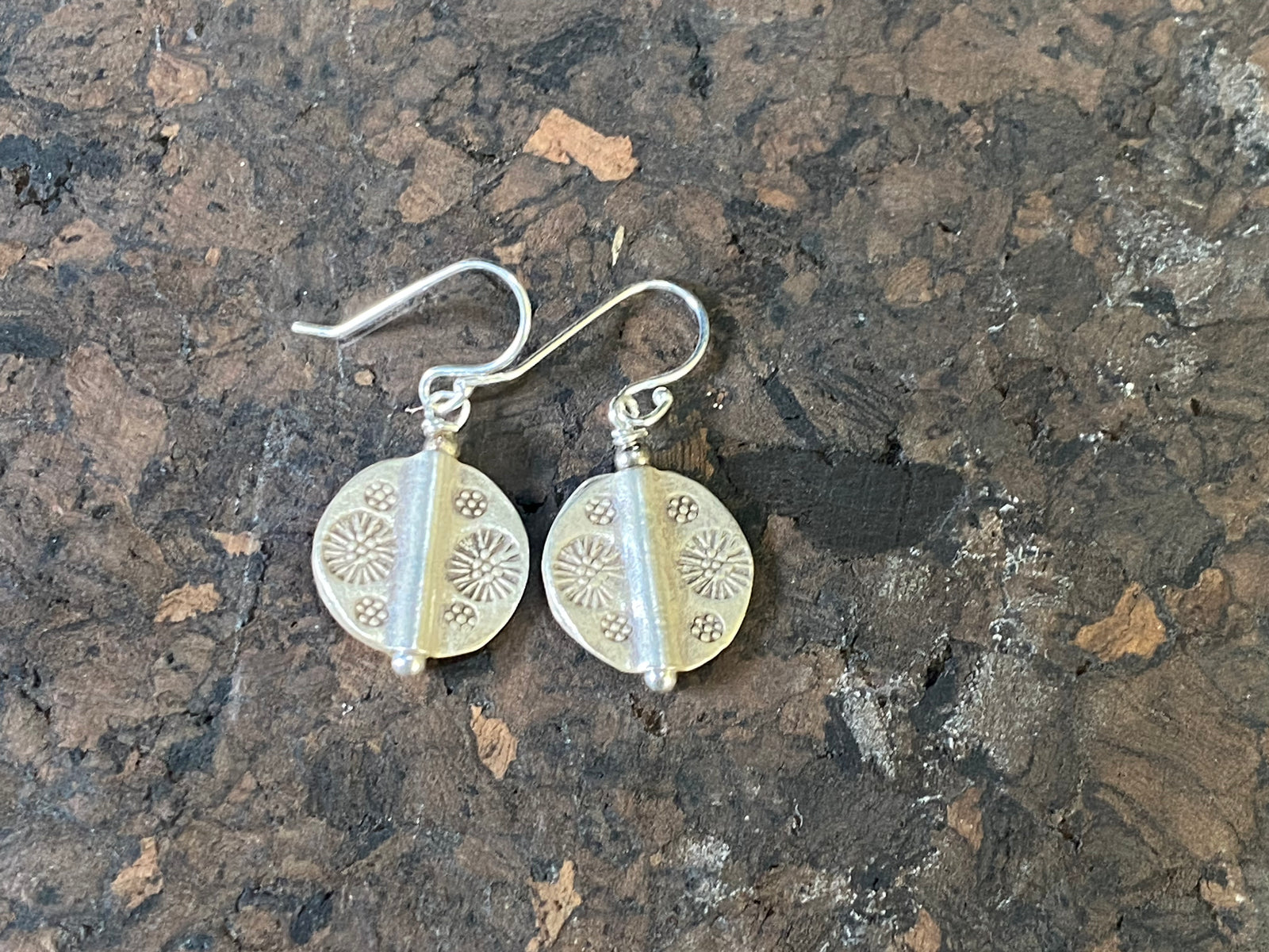Our most popular earring. Karen hill tribe charms of high grade silver finished with sterling silver hooks.  Charm 1.5 cm diameter, earring length 2.8 cm including hook 