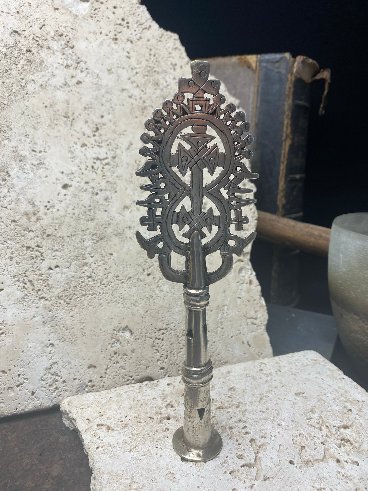 Ethiopian processional cross, hand cast by the lost wax method. Made from white metal and designed to be displayed and paraded in religious processions on top of wooden staffs, these are used vintage pieces dating to the 1970's, and are from the Lalibela region of northern Ethiopia. Height approximately 19.5 cm