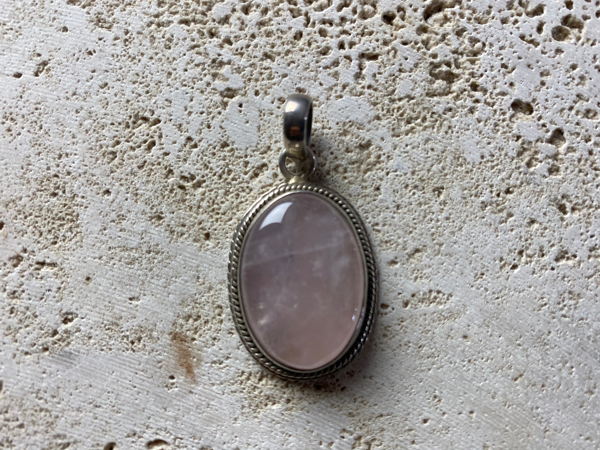 Oval rose quartz and silver pendant