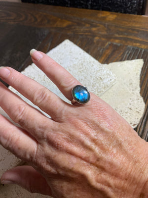 Round oval labradorite ring set in sterling silver. A high quality stone with deep blue fire.  Size 6