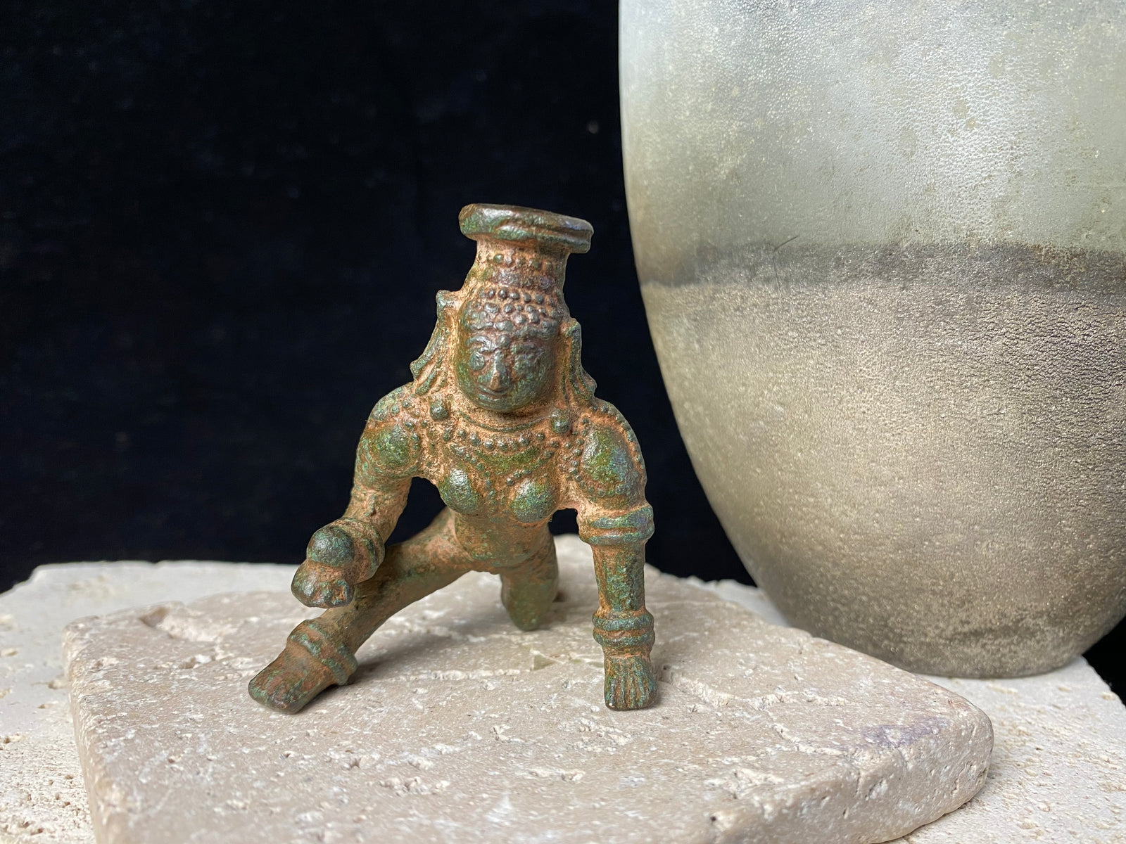 Bal Gopal Krishna. This antique devotional baby Krishna statue is cast from solid bronze, in a crawling posture carrying butter in his hand, 19th century, Orissa Provence, India. This statue has a darkened patina commensurate with its age. Measurements: height 6 cm (2.5"), length 6 cm (2.5")