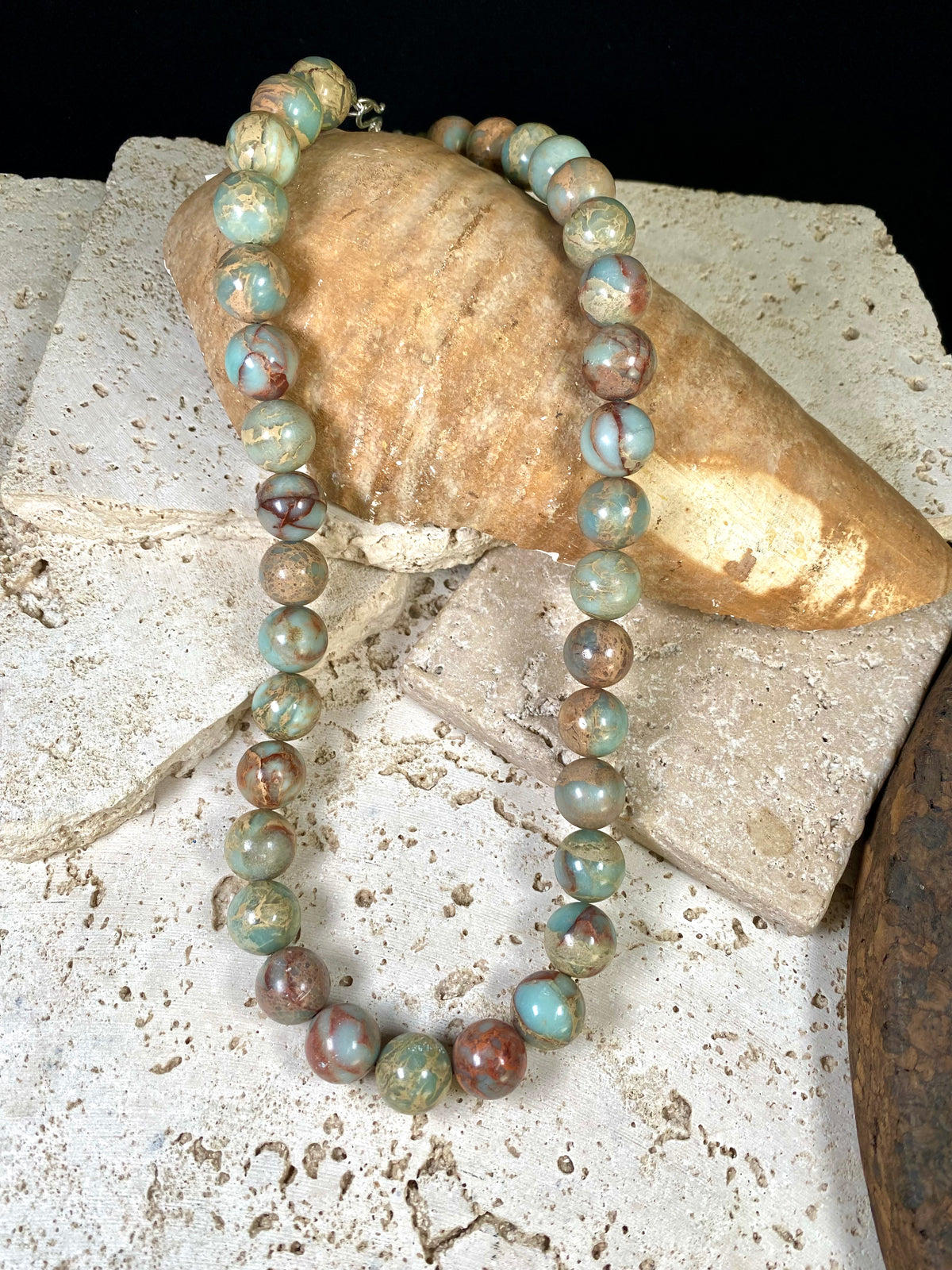 A mid length necklace made from large matched round Ethiopian opal beads, finished with sterling silver findings. Hook clasp. Length 55 cm