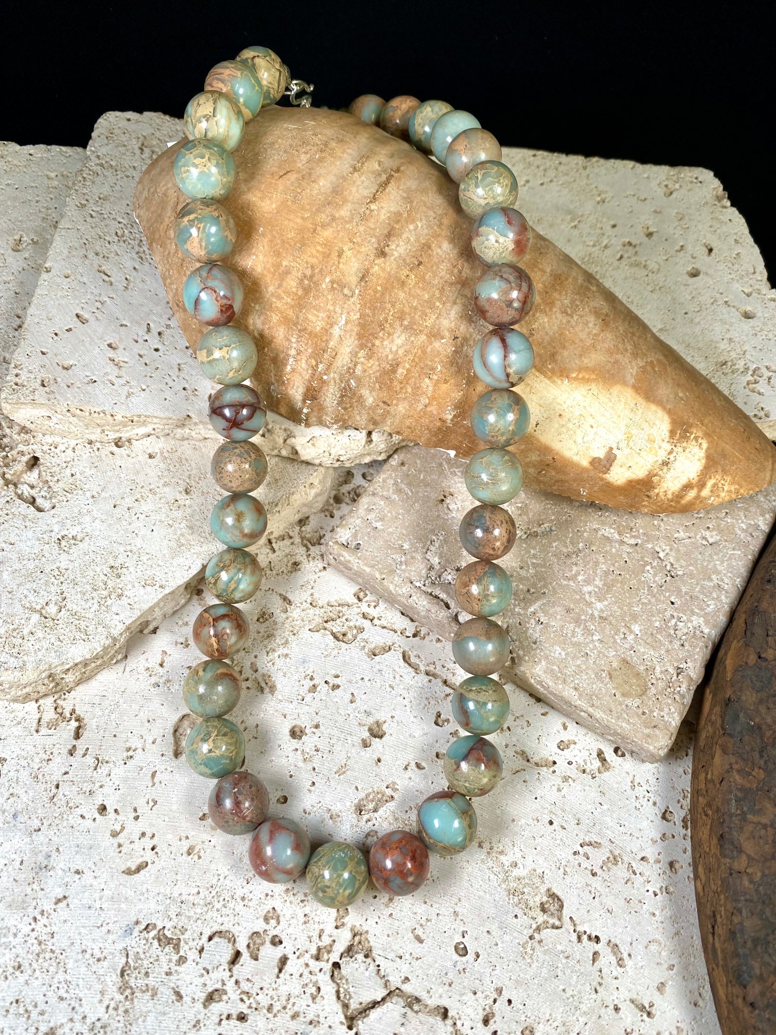 A mid length necklace made from large matched round Ethiopian opal beads, finished with sterling silver findings. Hook clasp. Length 55 cm