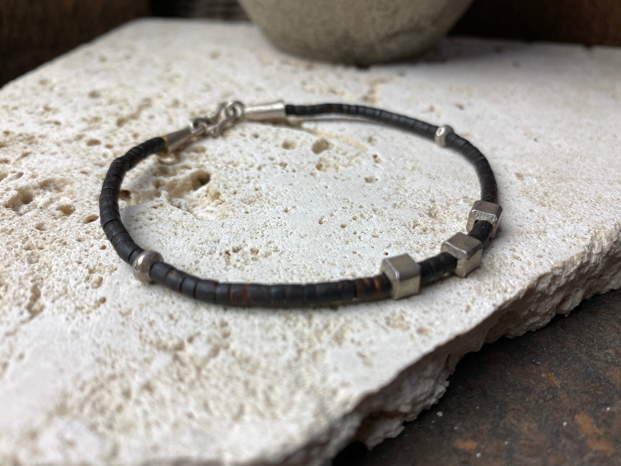 Our women or men's bracelet is made from fine cut coconut wood and hilltribe 95% pure silver. This Boho style bracelet is made from coconut wood beads and hill tribe 95% silver. Our tribal bracelets are understated, chic and modern, and are made for that stacked bracelet look.