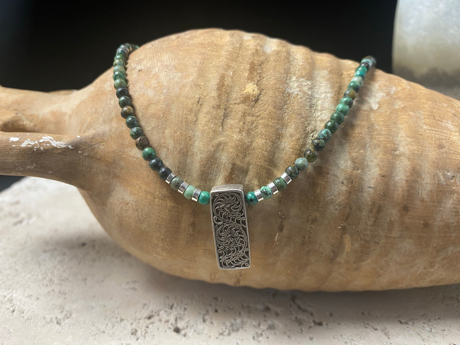 Contemporary necklace of round natural African turquoise, highlighted with sterling silver beads, a vintage Indian filigree silver pendant and sterling silver findings and clasp. Length 43.5 cm (17.25”), pendant 2.2 cm (1")