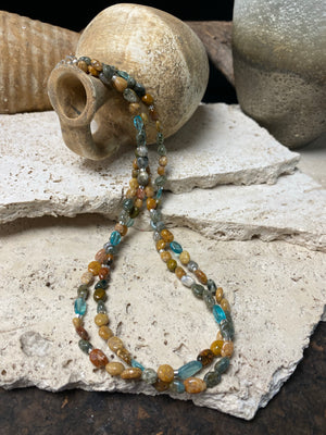 A casual beach vibe necklace made from two strands of polished pebble ocean jasper, highlighted with clear blue apatite and sterling silver. Our necklace is finished with a sterling silver hook clasp and findings and is 49 cm in length