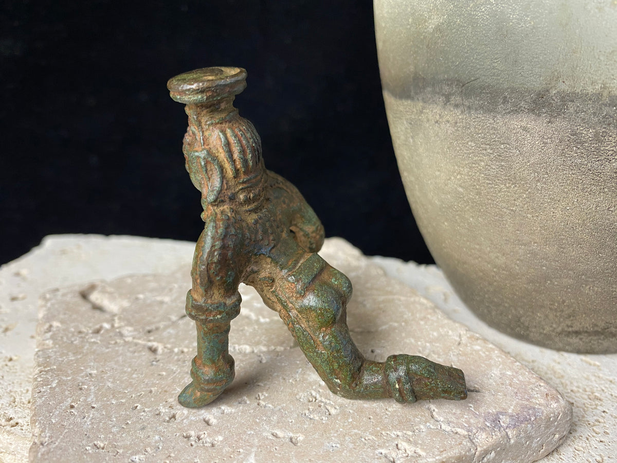 Bal Gopal Krishna. This antique devotional baby Krishna statue is cast from solid bronze, in a crawling posture carrying butter in his hand, 19th century, Orissa Provence, India. This statue has a darkened patina commensurate with its age. Measurements: height 6 cm (2.5"), length 6 cm (2.5")