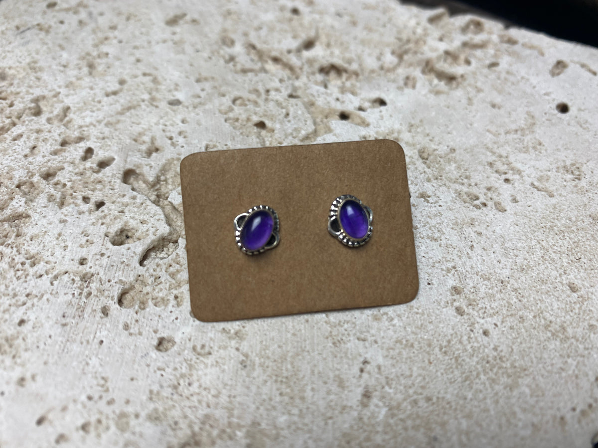 small amethyst earring studs are hand made from sterling silver
