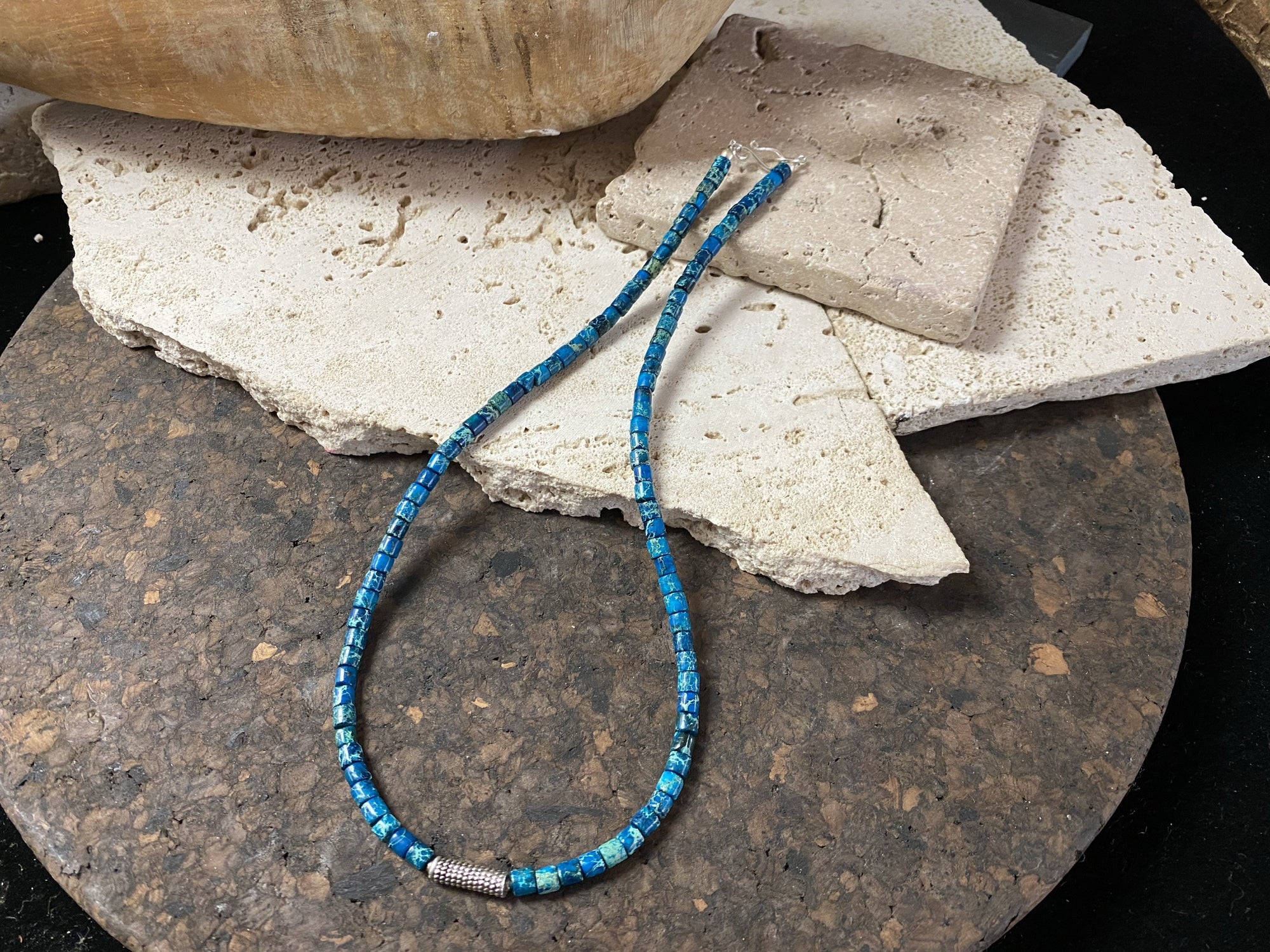 Strong blue green necklace crafted from natural blue jasper, with a heavy vintage silver bead as a centrepiece. Finished with sterling silver ends.  This is a unisex necklace that would look great on a guy or a woman. Length 46 cm (18")