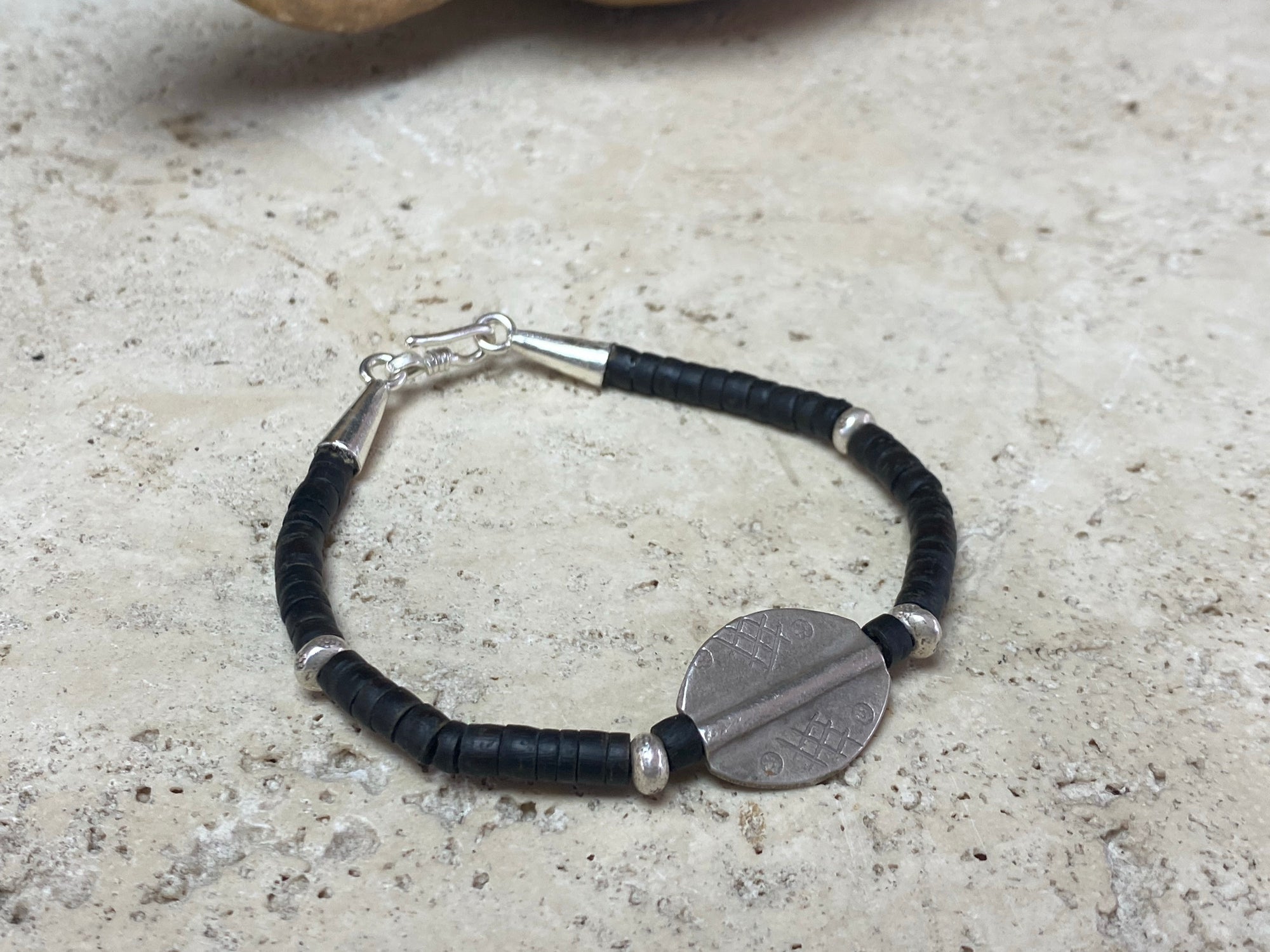 One of our signature coconut silver bracelets, crafted from polished coconut wood and hill tribe 95% silver A women's bracelet or a men's bracelet, it has a casual Boho vibe, and is made for that stacked bracelet look. Different sizes available