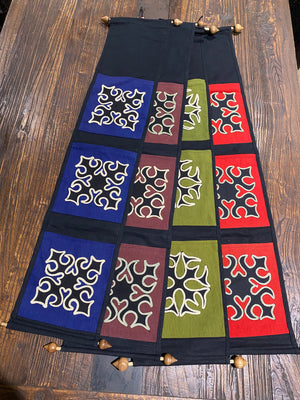 Hand made by Yao hill tribe people of Thailand for export, these pocket wall hangings are stylish & practical. Made from 100% cotton. Use them to hold things, or as wall hangings. The geometric symbols are very traditional in Yao culture and are considered protective. H 90 x W 18.5 cm, Pocket dimensions H 18 x W 16 cm