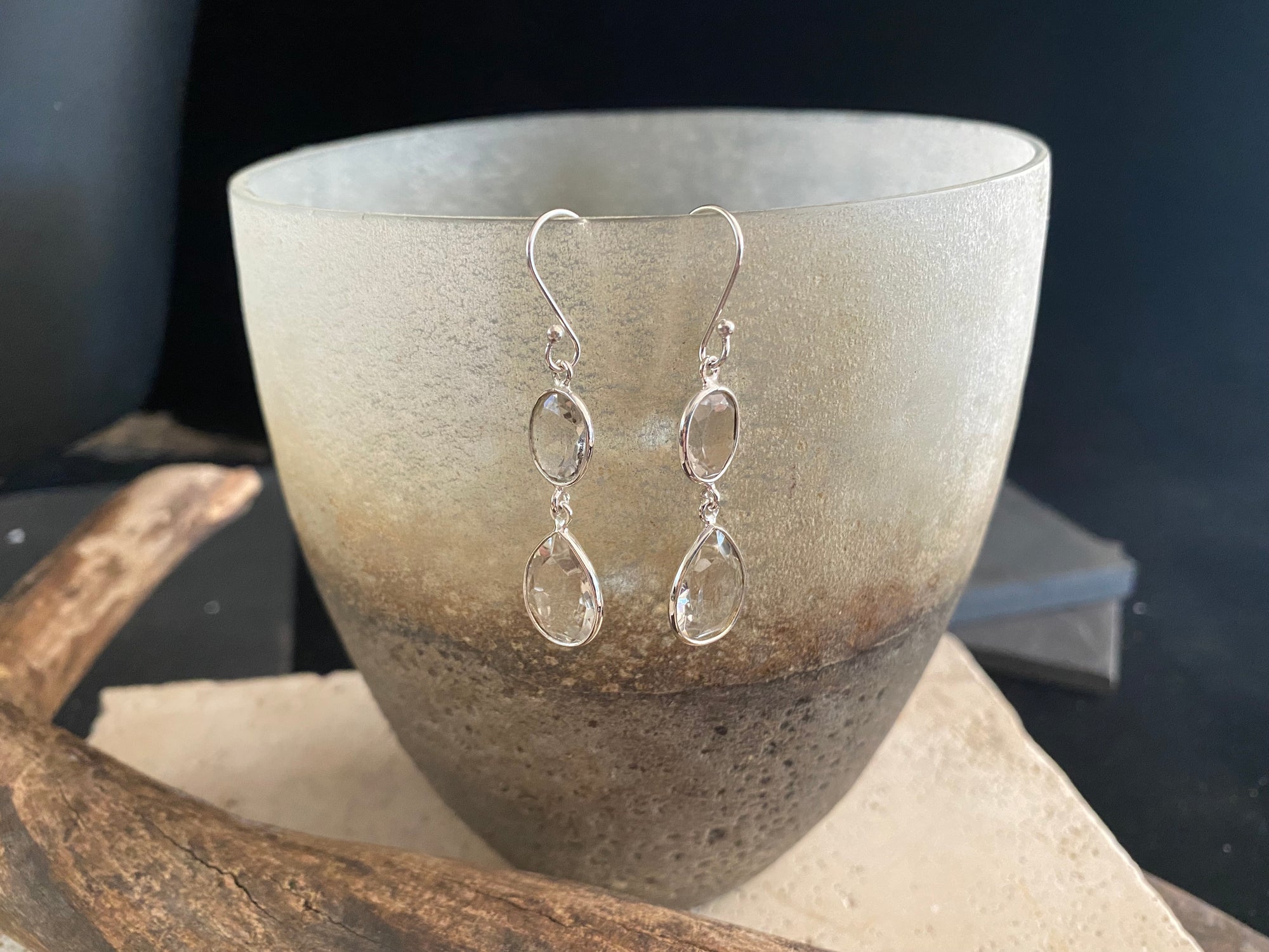 Visually stunning, facet cut drop earrings of facet cut clear or smokey quartz, finished with sterling silver mounts and hooks. The perfect drop earring. Length including hook 5 cm