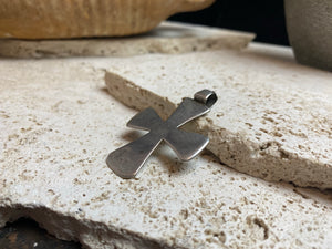 Early 19th century northern Ethiopian high grade silver crucifix, cut from a Marie Therese silver thaler. Plain front and back. Very heavy wear at the head of the bail.  A wearable and collectable antique silver cross. Length including bail 5 cm (2")