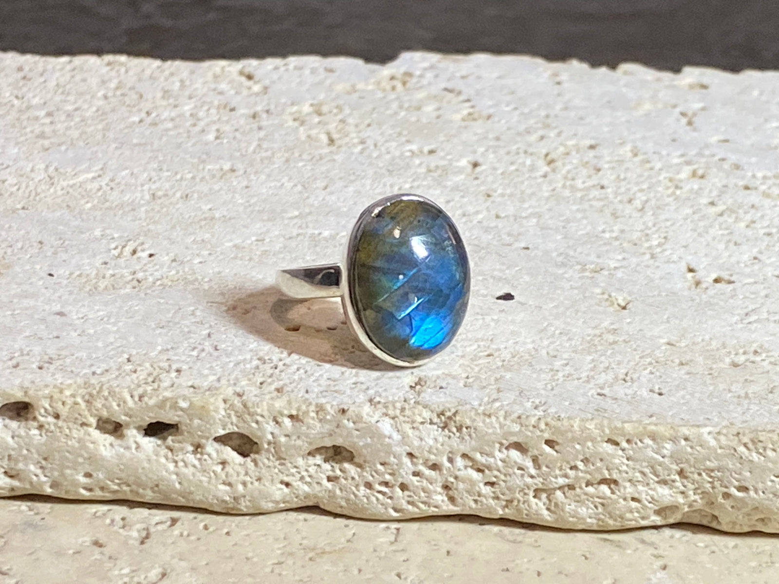 Round oval labradorite ring set in sterling silver. A high quality stone with deep blue fire.  Size 6