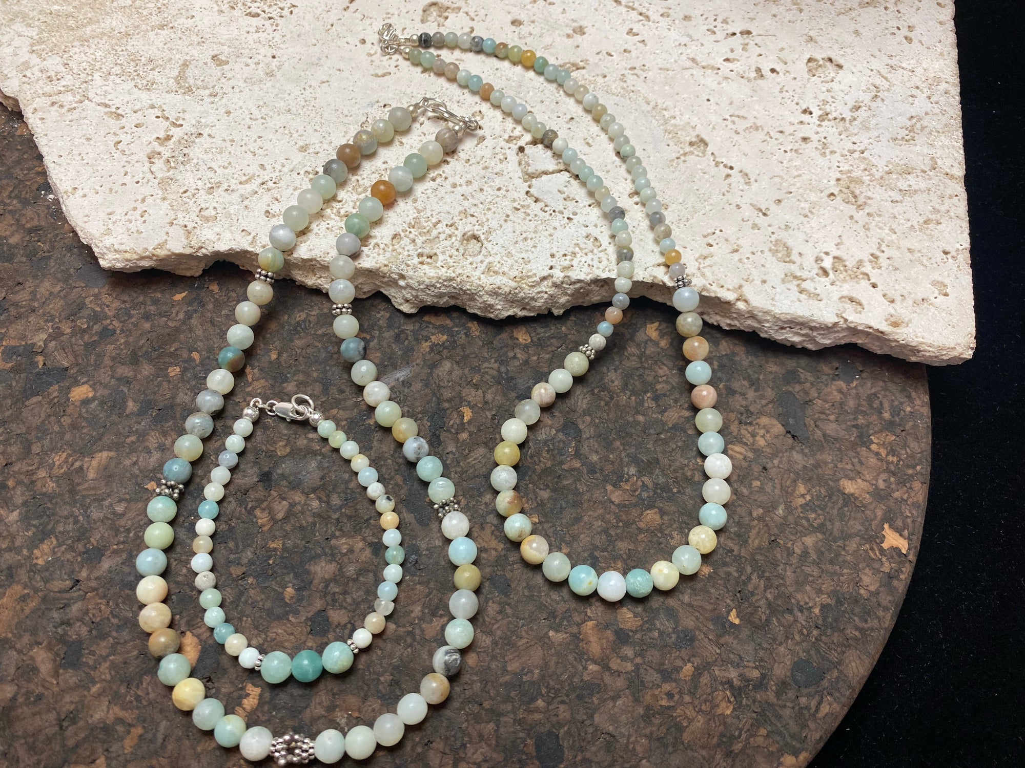 Glowing natural pastel hued graduated quartz beads teamed with sterling silver feature beads and findings