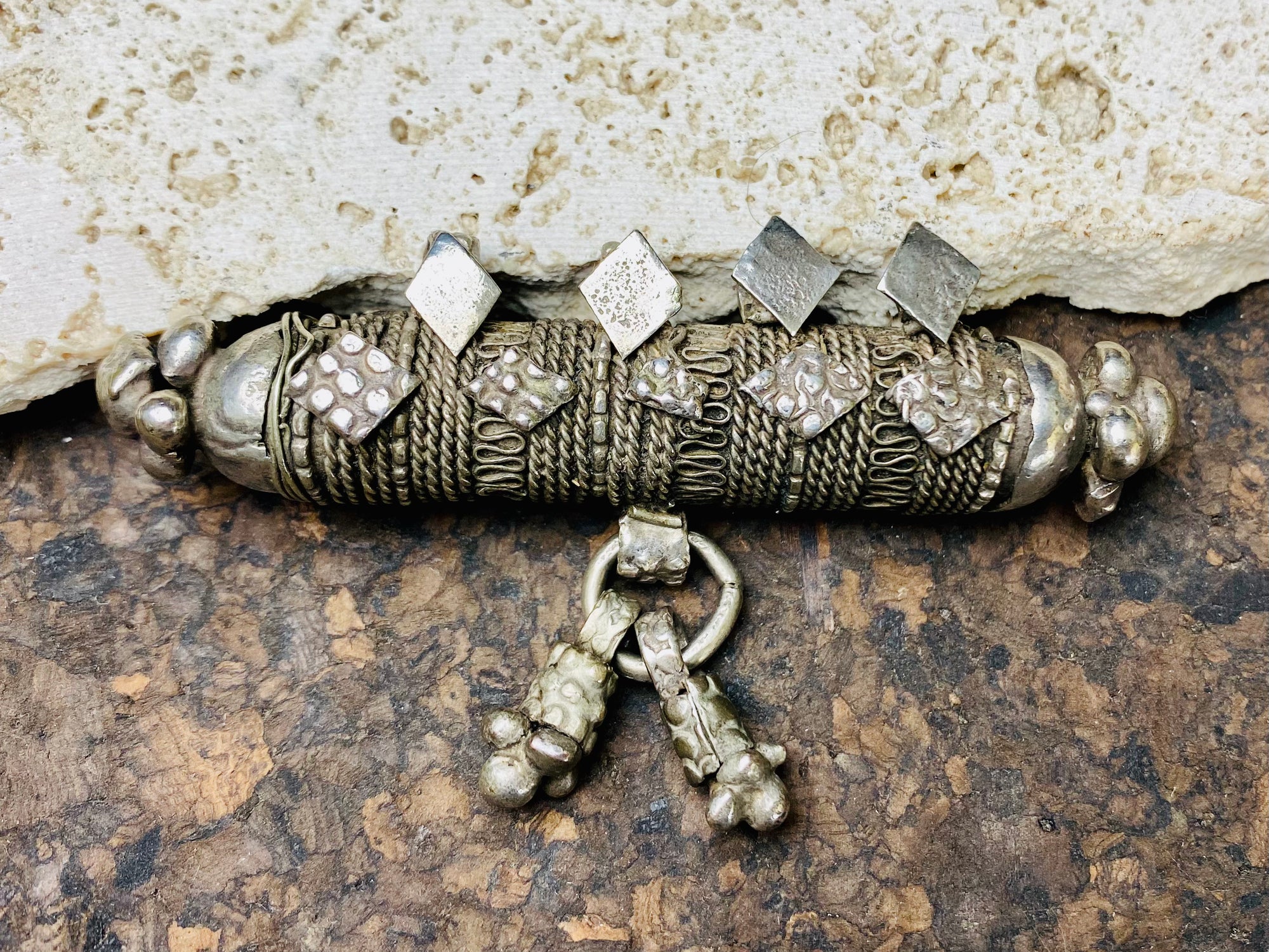 High grade, heavy silver amulet with fused ends, mid 19th century, from Afghanistan. Length 8.5 cm