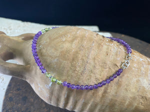 Beautiful anklets featuring natural amethyst, peridot and sterling silver. Sterling silver clasps and detailing. Designed to sit gracefully around the foot rather than tight to the ankle. Select from three sizes.