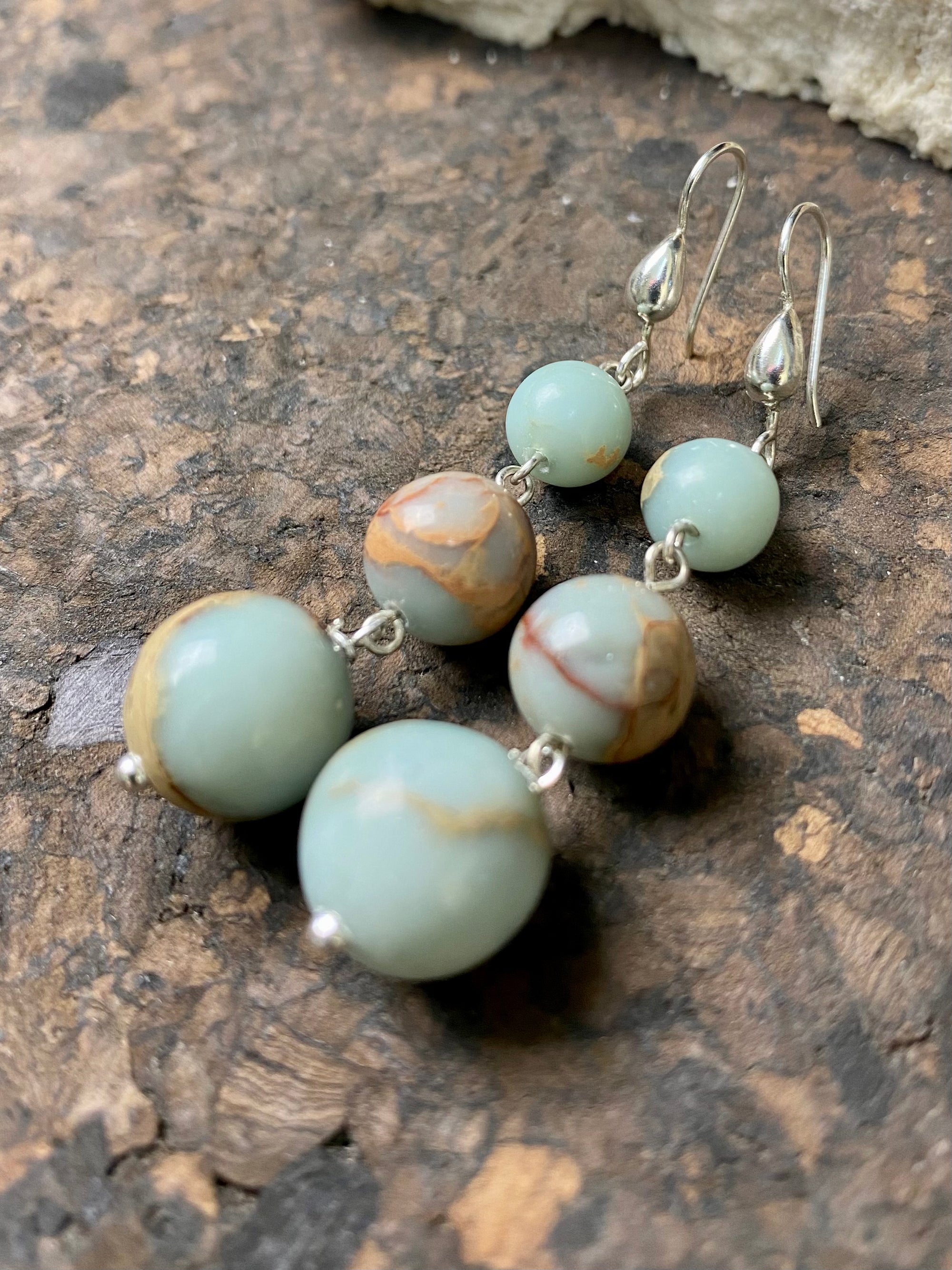 Three stone dangle earrings made from Ethiopian opal. Elegant sterling silver hooks complete the look. Length including hook 6 cm