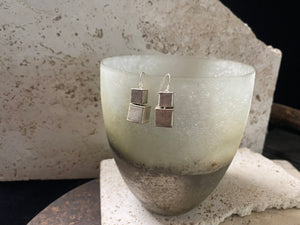 Silver earrings crafted from cubes of matted silver cleverly attached so they can move and swing independently of each other. Fascinating to look at, with a beautiful industrial effect. Length 3.5 cm