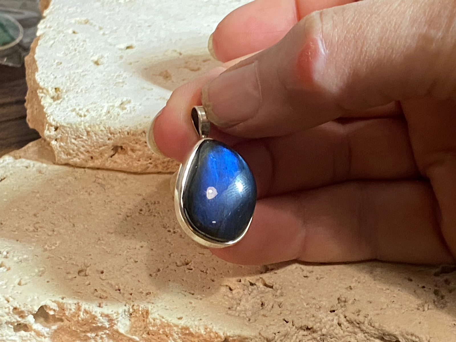 Stunning free form labradorite pendant set in sterling silver with a generous bail to take a large chain or cord. A quality stone with dark blue colour.