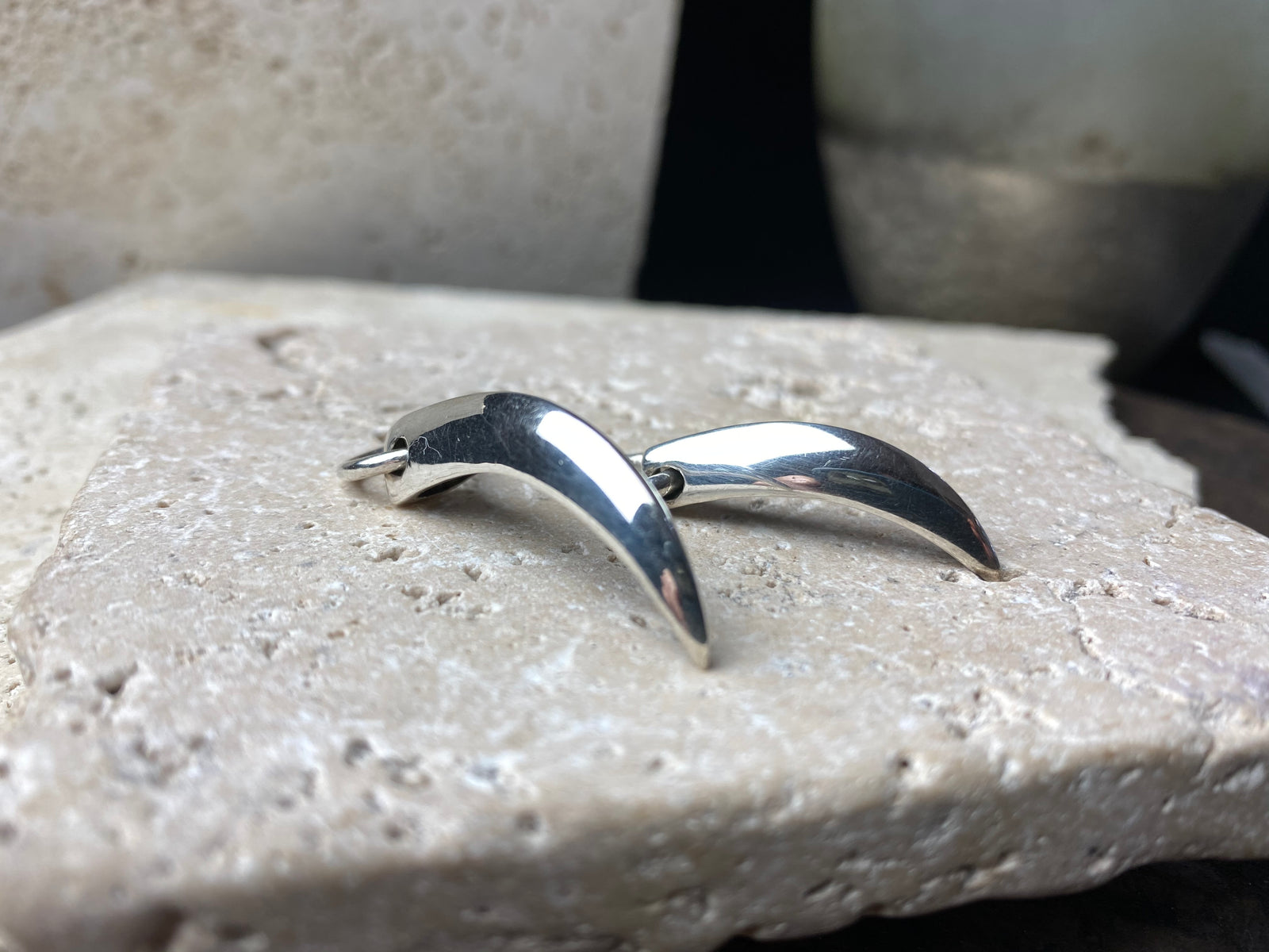 Simple sterling silver claw pendants, complete with large closed jump rings