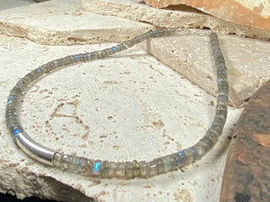 Striking choker necklace of rondel-cut labradorite, highlighted with a central sterling silver pendant bead. This necklace is finished with a sterling silver hook clasp. Length 42 cm