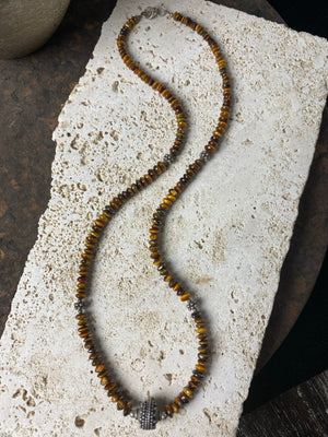 graduated natural tigers eye necklace features a central handmade vintage Indian silver bead and sterling silver detailing