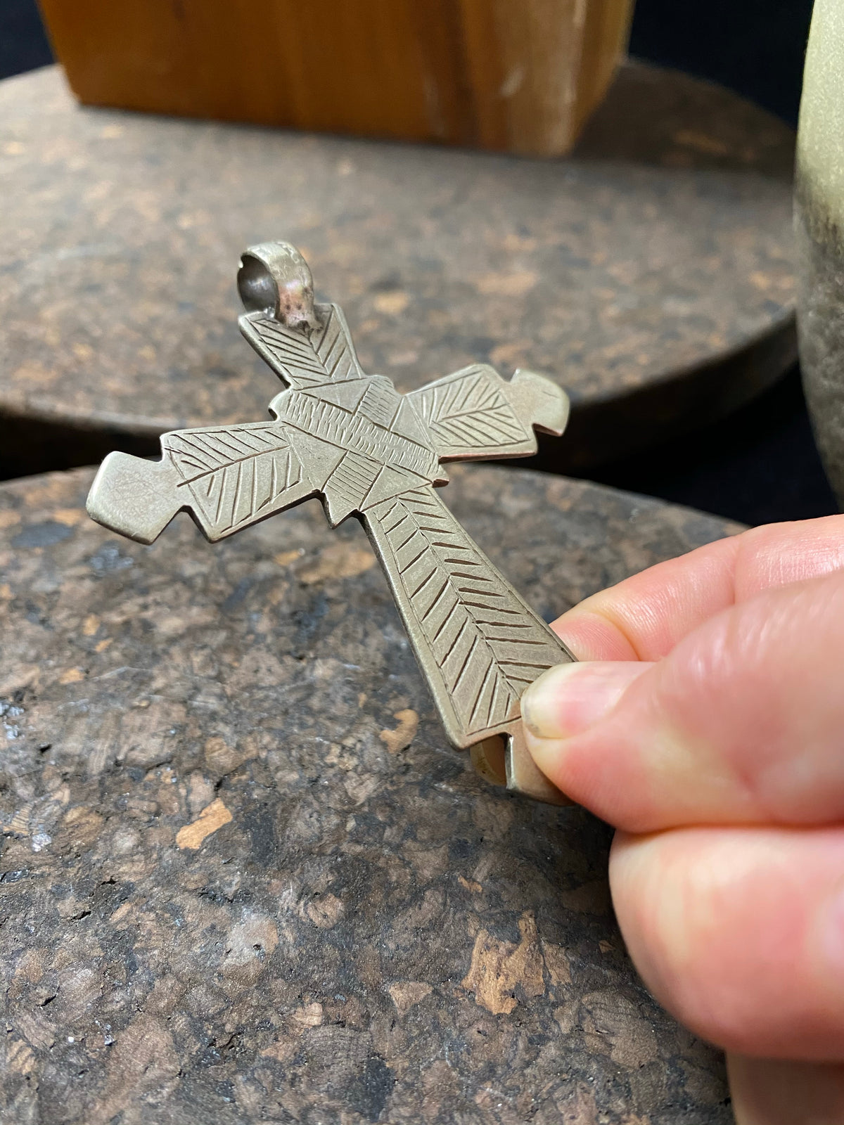 Early 20th century Ethiopian silver cross, most likely cut from a Marie Therese Thaler. Silver, with a simple engraved decoration on each side and light wear at the head of the bail,  total height including bail 7.5 cm (3")