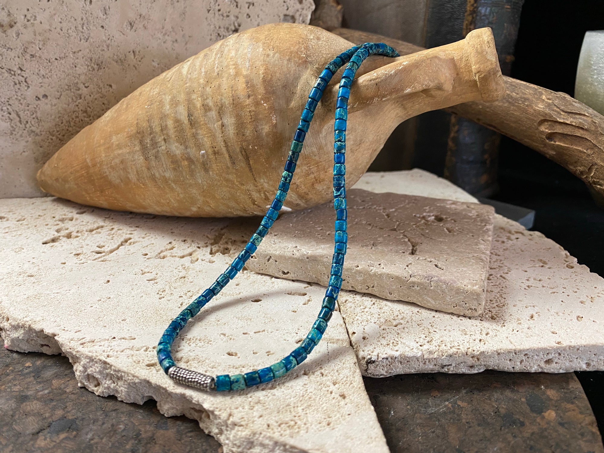 Strong blue green necklace crafted from natural blue jasper, with a heavy vintage silver bead as a centrepiece. Finished with sterling silver ends.  This is a unisex necklace that would look great on a guy or a woman. Length 46 cm (18")