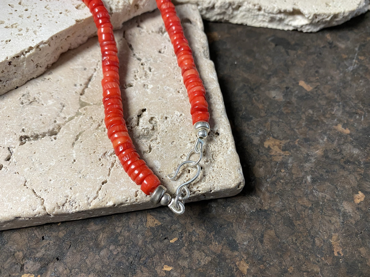 Our simple coral necklace features red coral heshi beads finished with a sterling silver beads and hook clasp. A smart and elegant Southwest style choker that can be worn by men or women.  Bamboo coral is dyed and responsibly sourced from the Pacific Ocean. Length 45 cm (17.75"), diameter of beads 7 mm