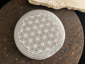 Large, engraved selenite charging plate or stand for the display of crystals and other important objects. Diameter 14.8 cm